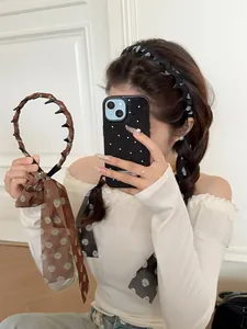 Detail of French vintage brown polka dot chiffon scrunchie and anti-slip hairband