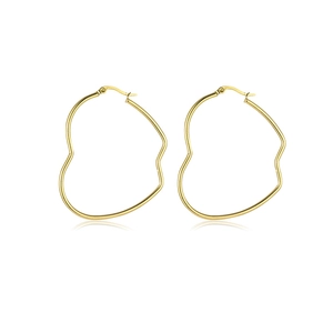 Detail view of large gold-plated stainless steel heart-shaped hoop earrings on white background