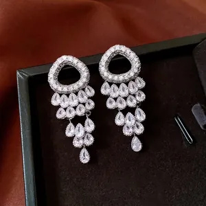 Elegant silver tassel earrings with zircon waterdrop fringe on black velvet display