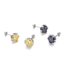 Macro detail of cubic zirconia earrings featuring silver screw backs and vibrant stones