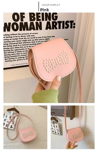 Detailed view of girls pink crossbody bag with cute pearl bow and PU leather texture