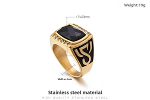 Detail of a gold stainless steel men's ring with a black gemstone and crystal pavé