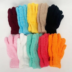 Flat lay of colorful plush knit winter gloves in ten vibrant candy colors on white background