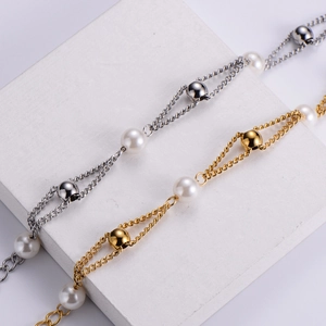 Lustrous freshwater pearl bracelet with titanium steel beads in gold and silver finish