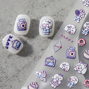 3D relief nail stickers featuring purple and pink cartoon dogs with donut and cupcake designs
