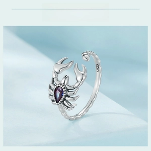 Close-up of S925 sterling silver scorpion ring with purple teardrop gemstone