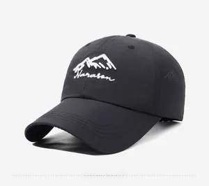 Detailed close-up of mountain embroidery and white Narasan text on black baseball cap