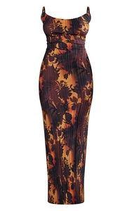 Detail of pleated texture and abstract floral print on slim fit camisole maxi dress