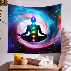 Detailed view of chakra meditation tapestry hung on a wall with cozy bedroom decor