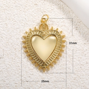 Detailed view of heart pendant measuring 31mm by 25mm in gold finish with measurements