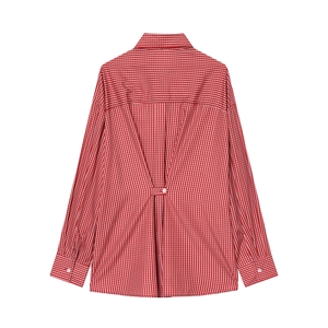 Detailed back view of red and white checkered poplin shirt with pleat details