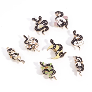 Set of 8 gothic enamel pins featuring snakes with moon star and flower motifs