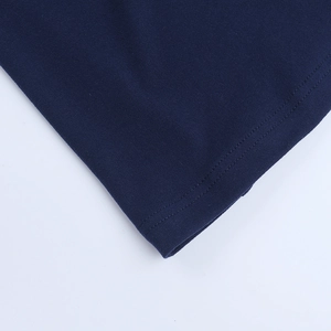Close-up of double-needle stitching on the hem of dark blue lace evening gown