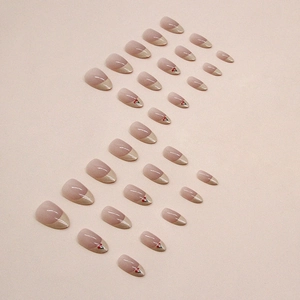 French tip press-on nails with sweet cherry designs and creamy pink gradient finish