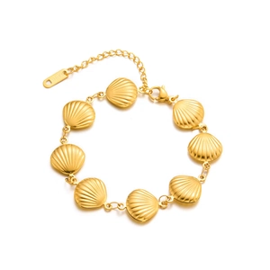 Elegant gold stainless steel shell bracelet featuring luxury beach style for women