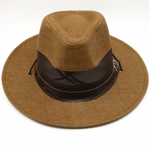 Detail of men's brown straw hat with breathable mesh band and crocodile texture strap