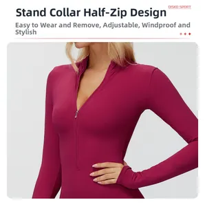 Detail of mock neck half-zip closure on magenta thermal fleece yoga bodysuit