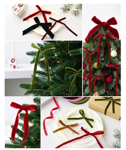 Detailed view of velvet Christmas bows in multiple colors used for festive tree decoration