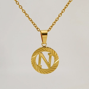 Detailed close-up of 18K gold-plated stainless steel hollow letter N pendant necklace