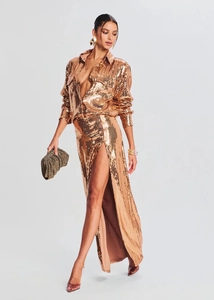Elegant rose gold sequin two-piece set featuring long sleeve shirt and high slit maxi skirt