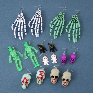 Detailed set of Halloween earrings featuring skulls, skeletons, and black cats