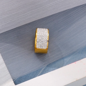 Detailed macro view of 18k gold plated wide band ring with multi-row crystal pave