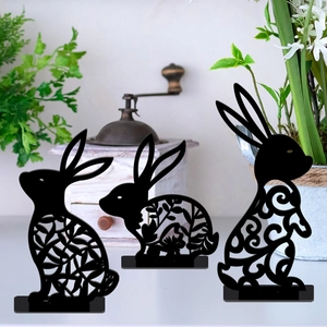 Detailed view of black Easter bunny acrylic silhouette with intricate floral hollow carvings