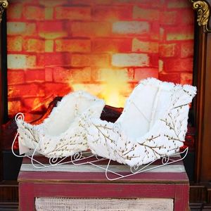 Set of white velvet Christmas sleigh decorations with gold branch print on wood base