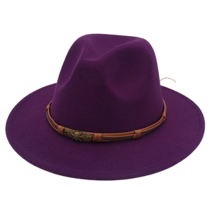 Detail of purple wool felt fedora featuring leather band and bronze skull ornament