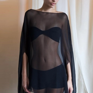 Detail of black sheer chiffon beach cover-up with off-shoulder cut and batwing sleeves