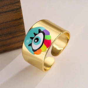 Detailed close-up of 18K gold-plated wide ring featuring colorful enamel evil eye patterns