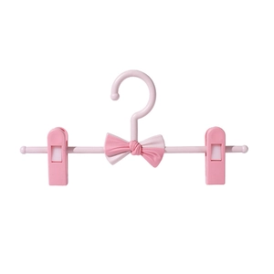 Pink adjustable kids pants hanger with bow design and non-slip clips for home use