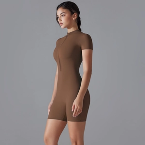 Detail of slim fit coffee brown yoga romper with front zipper and stand collar
