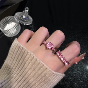 Pink heart and rectangular gemstone open rings on hand with silver base setting
