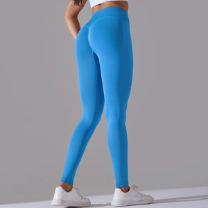 Detail view of seamless electric blue yoga pants with high-waist shaping and lifting effect