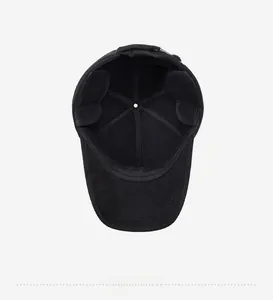 Detail of warm winter baseball cap featuring thickened inner lining and ear protection flaps