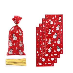 Christmas gift bags with Santa and reindeer prints plus golden twist ties for holiday treats