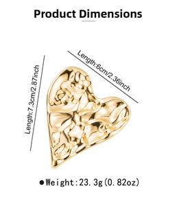 Detailed view of large gold heart brooch with hammered texture and size measurements