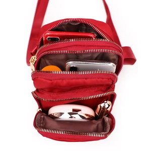 Three-layer red nylon crossbody phone bag for women with multi-zipper compartments