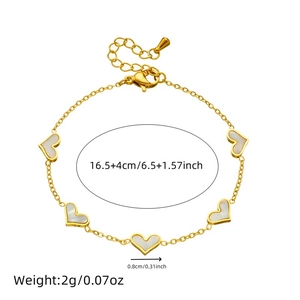 Gold plated heart chain bracelet with white shell inlays and size measurements
