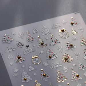 3D relief Christmas nail stickers with snowflake, tree, and star patterns in festive colors