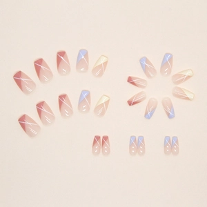 Geometric press-on nails set with nude pink, blue, and yellow abstract color blocks