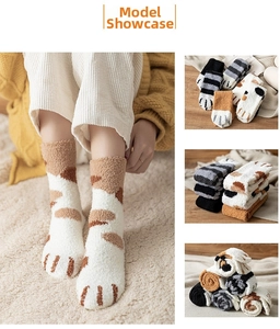 Detail of coral fleece cat claw socks with cute paw prints and plush winter texture