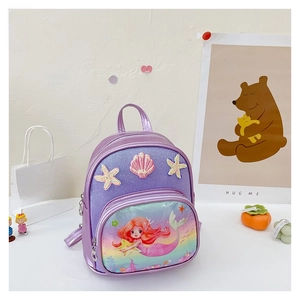 Detail of a purple mermaid princess backpack for girls featuring sequins and shell patches