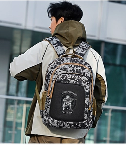Detail view of digital camo backpack featuring soldier print and strong courage text