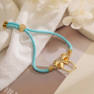 Blue woven adjustable bow bracelet with gold plating and zircons for women