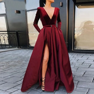 Elegant burgundy velvet and satin evening gown with a deep V-neck and high side slit