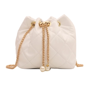 Chic white quilted drawstring bucket bag with gold chain strap and pearl charms