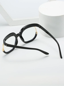 Detailed 45-degree angle view of Y2K owl style oversized black and gold fashion glasses