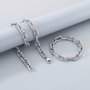 Polished silver stainless steel link necklace and bracelet set on display